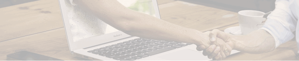 Woman's arm coming out of the computer for a handshake