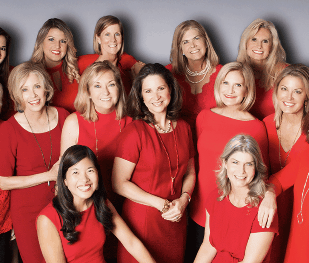 Circle of Red, Group of Women wearing red and smiling