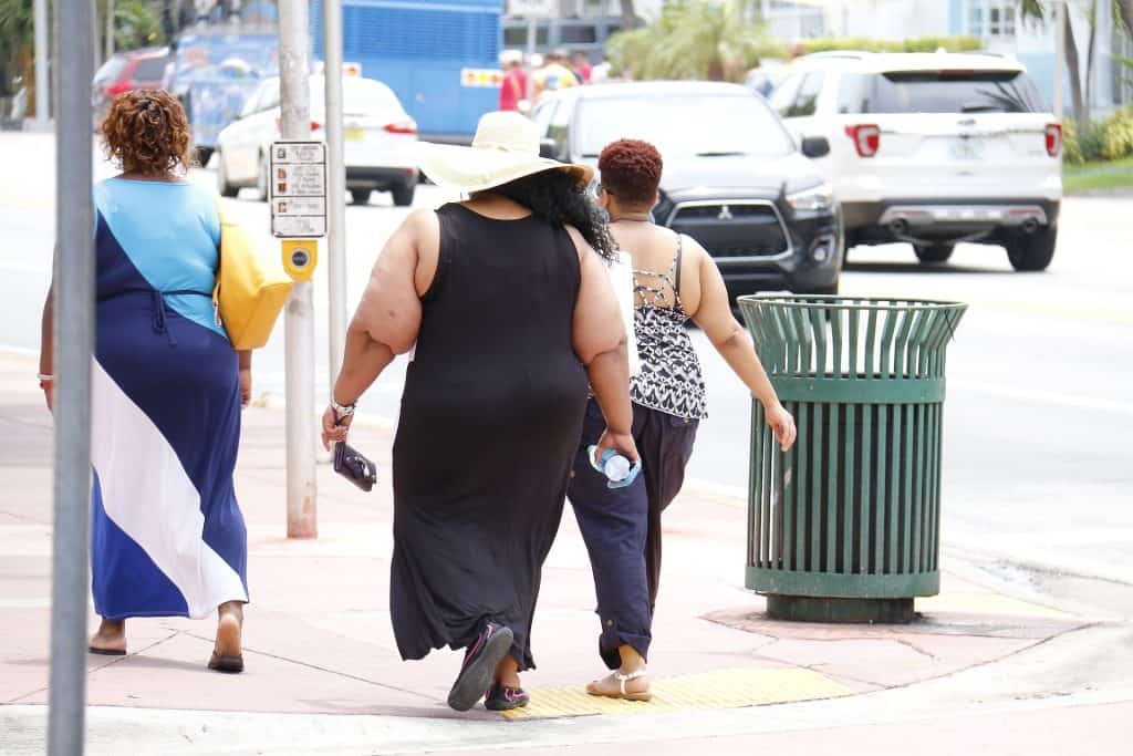 Obese black women walking in the street