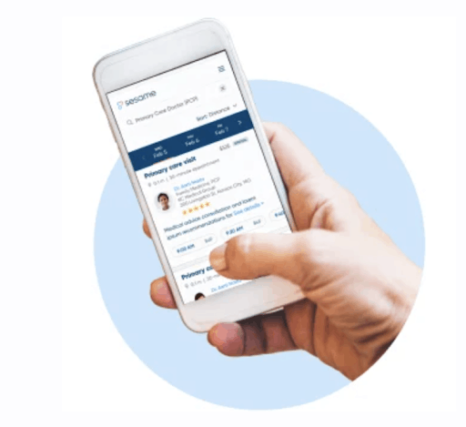 Hand holding a phone with Sesame Care platform on screen with blue bubble in background